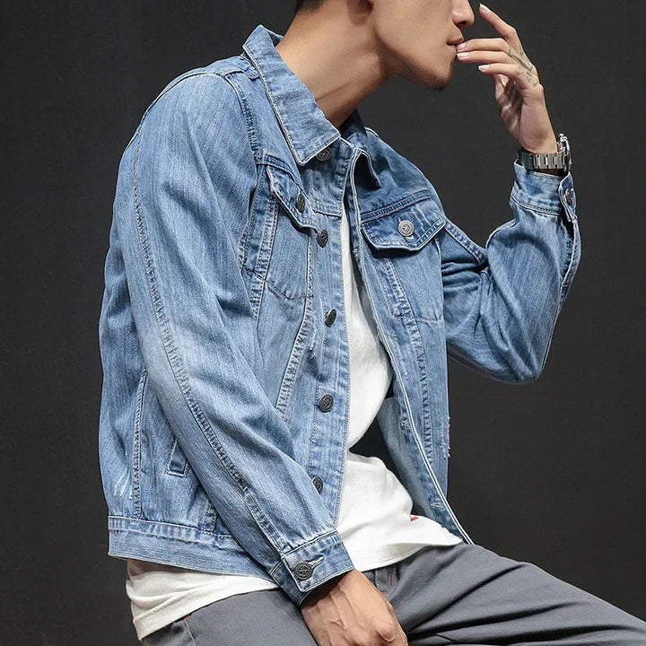 Versatile men's classic denim jacket with distressed details, ideal for casual and modern streetwear looks.