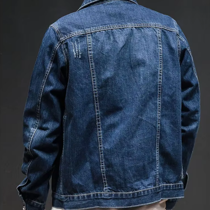 Men's classic distressed denim jacket, a staple for men's fashion, offering a relaxed and casual fit.