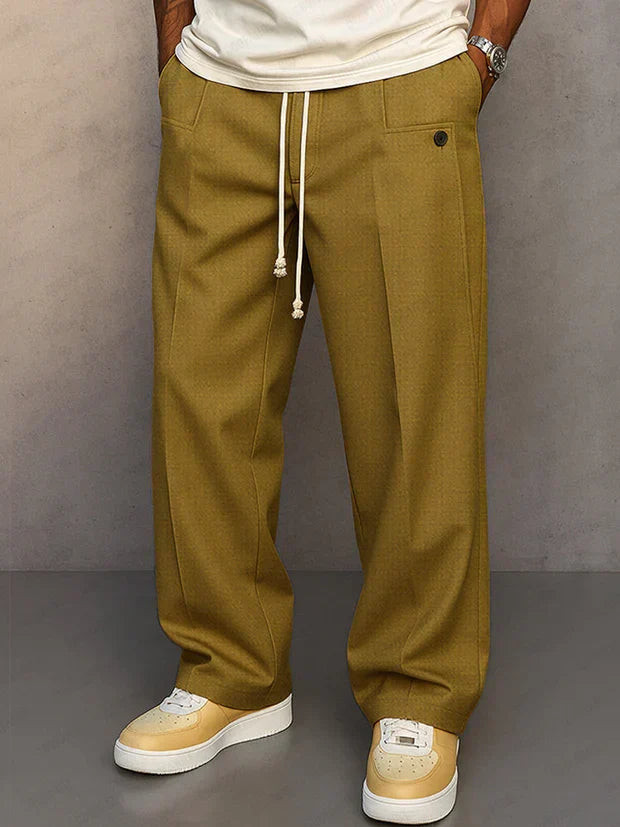 Relaxed fit men's casual trousers with adjustable drawstring waist, ideal for modern smart-casual fashion.