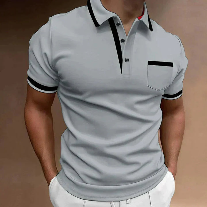Stylish man wearing a classic short-sleeve polo shirt, ideal for everyday comfort & versatile office or casual attire.