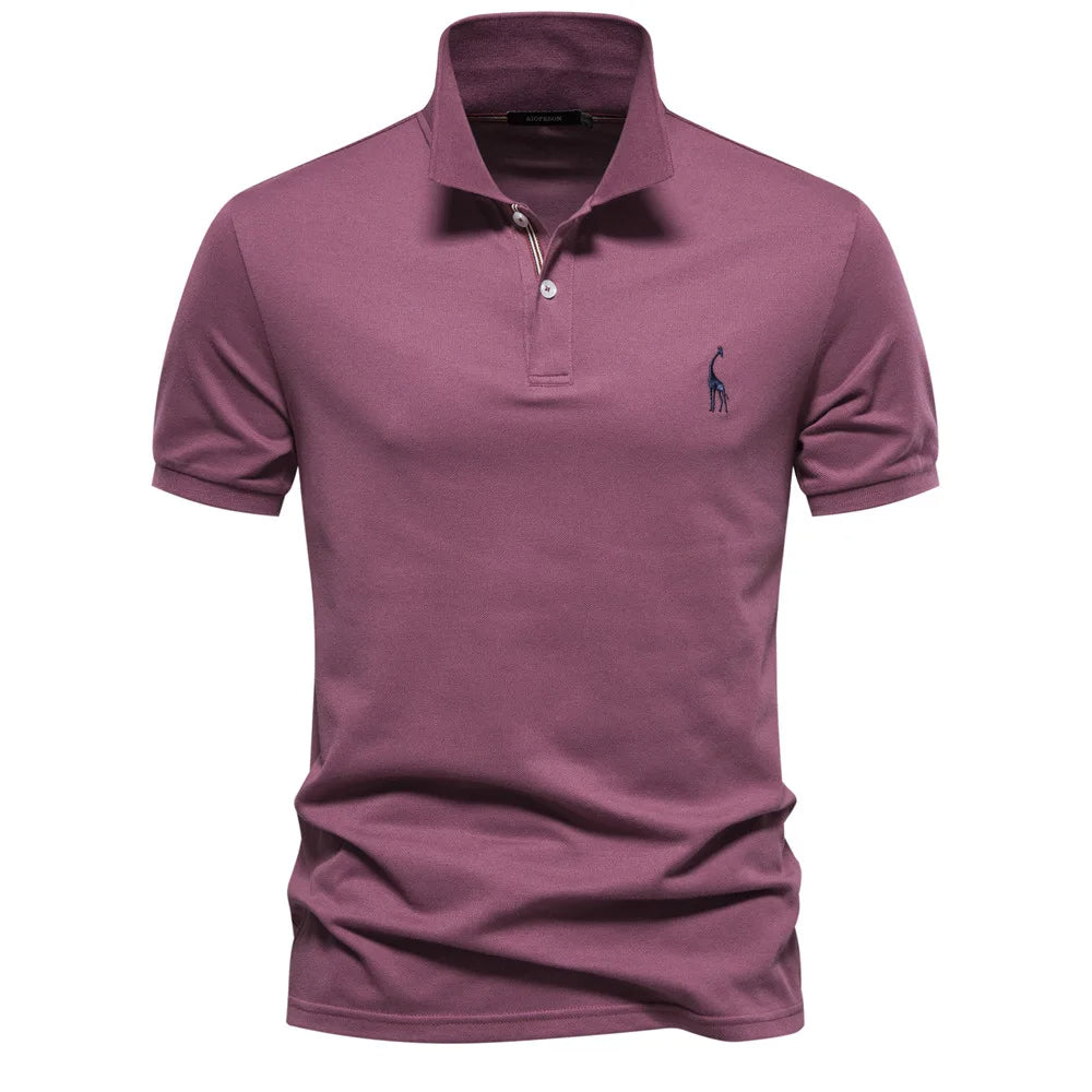 Detailed close-up of the subtle embroidery on a men's classic cotton polo shirt.