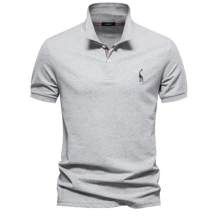 Timeless men's classic embroidered cotton polo shirt, neatly folded for display, new collection.