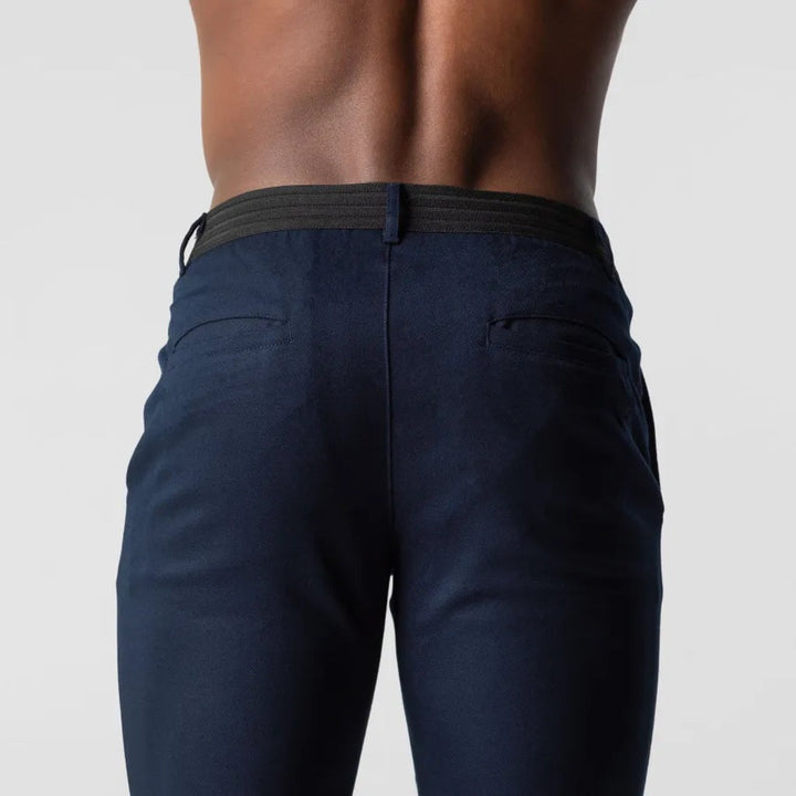Man walking in comfortable, classic fit men's chino pants, suitable for active everyday and dress wear. Men's fashion.