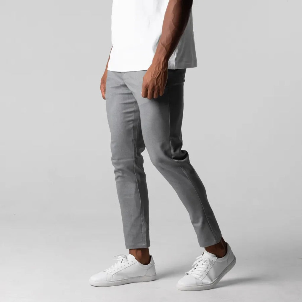 Close-up: Durable, soft fabric of men's beige chino pants, showcasing quality for versatile everyday wear & fashion.
