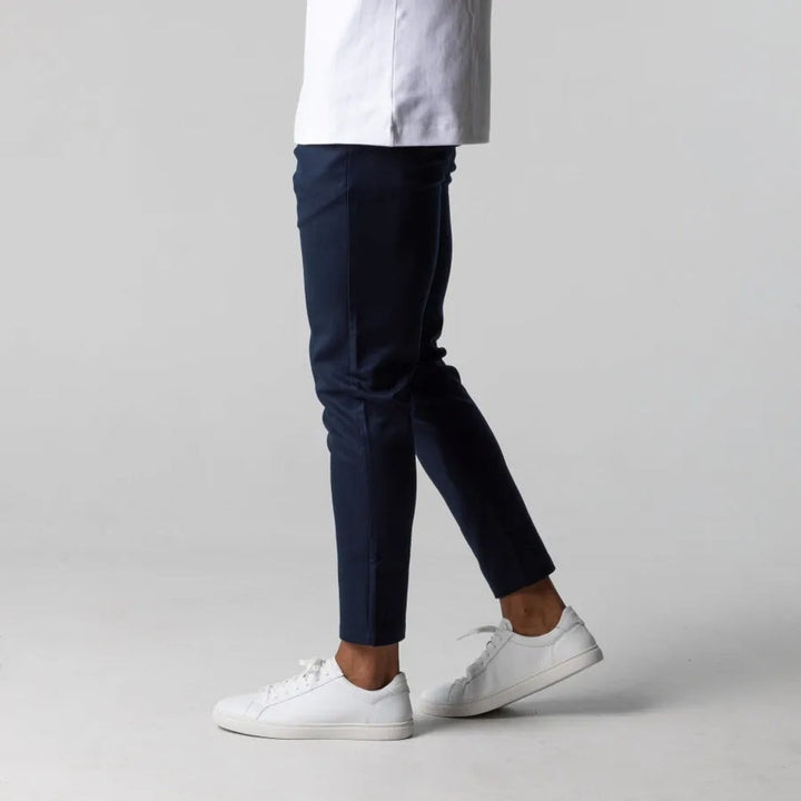 Front view of men's grey chino pants, featuring clean flat front & belt loops for classic everyday wear. Stylish apparel.