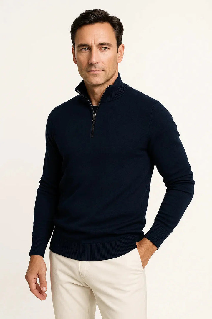 Neatly folded men's quarter zip sweater. An essential, minimalist pullover for versatile layering.