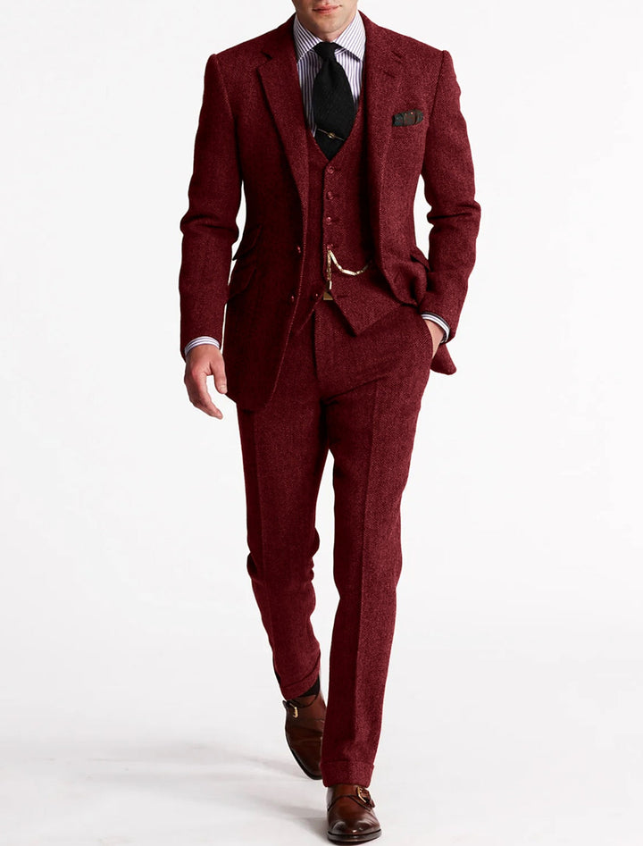 Sophisticated men's classic style formal suit. Three-piece set with vest chain, ideal for business & elegant events.