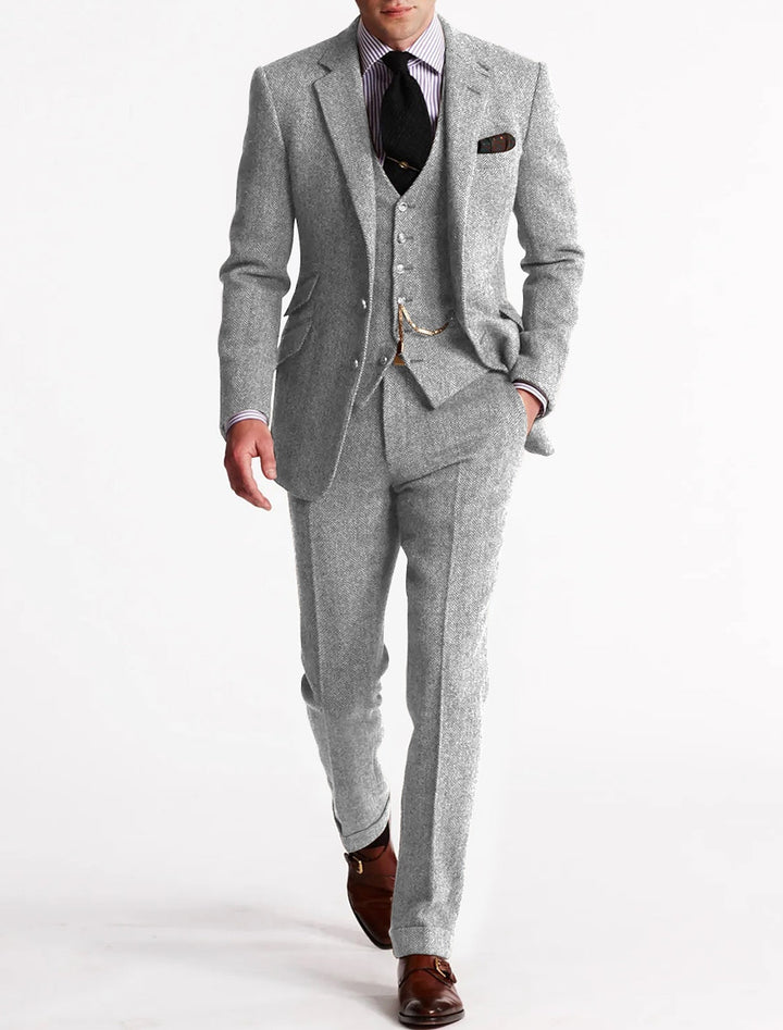 Stylish autumn/winter men's classic formal three-piece suit. Elegant vest, jacket & trousers for events.