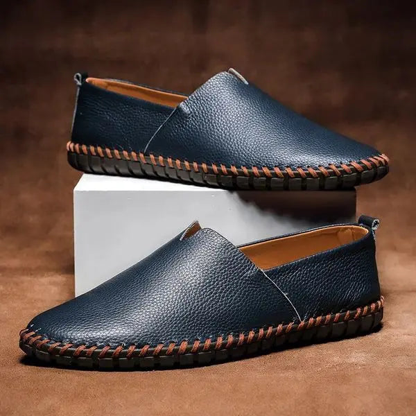 Men's classic hand-stitched leather loafers, elegant slip-on footwear for both casual and formal occasions.