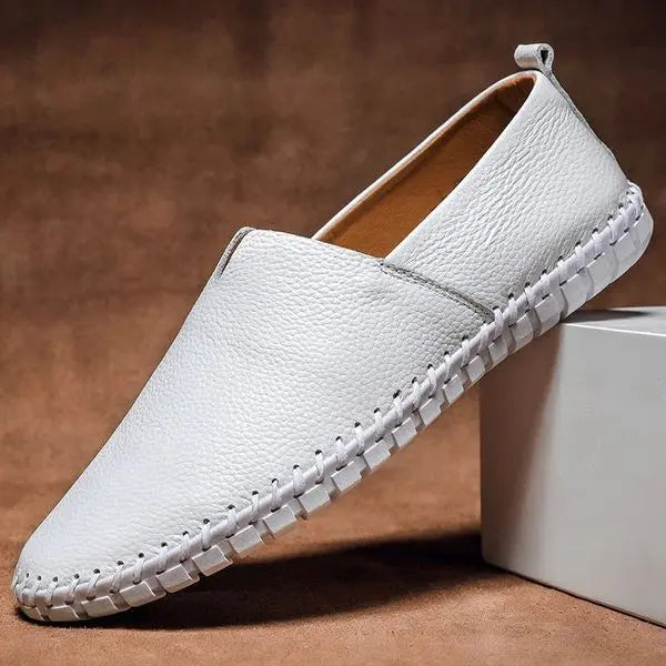 Stylish men's formal black slip-on loafers, hand-stitched detailing on premium leather, ideal classic footwear.