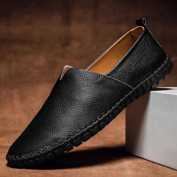 Men's versatile hand-stitched leather casual loafers, providing comfortable slip-on style for everyday wear.