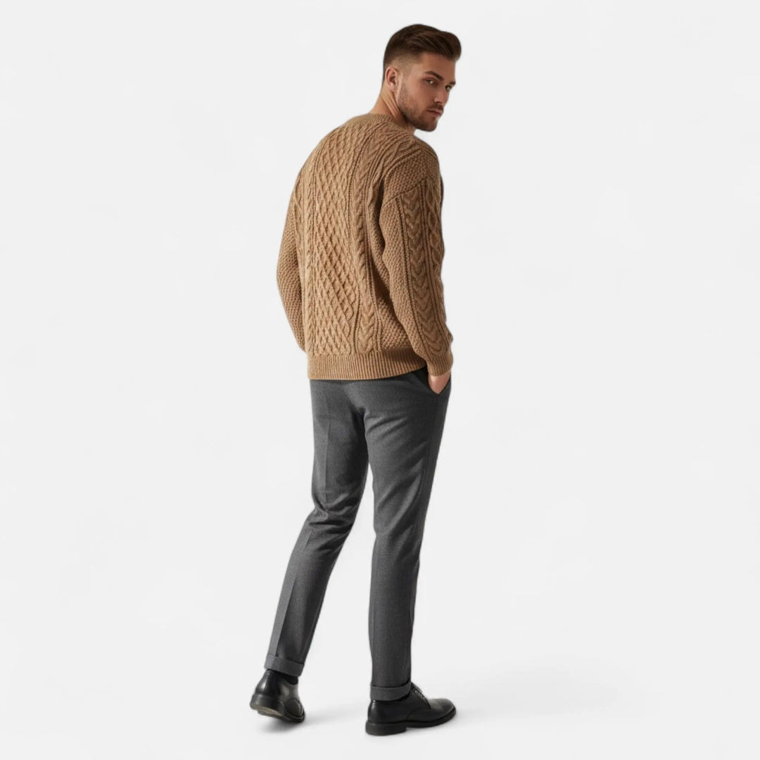 Close-up of elegant men's knit pullover sweater. Sophisticated textured fabric, perfect for layering & refined style.