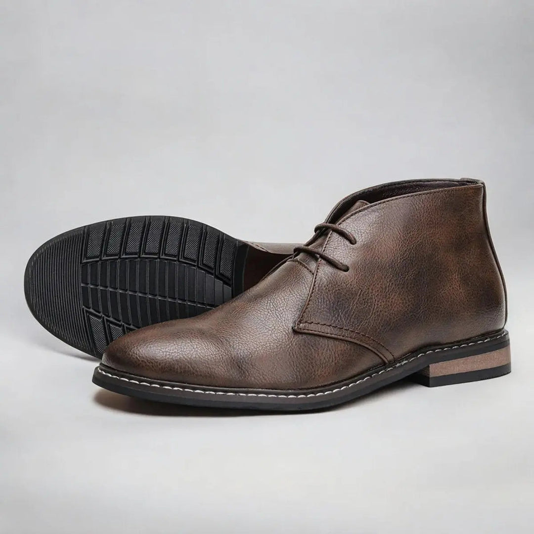 Classic men's lace-up chukka boots, offering versatile smart casual style. Polished ankle footwear for men.