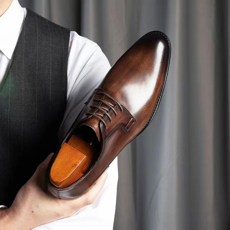 Stylish brown leather formal shoes for men, great for business professional looks & elegant events. Comfortable fit.