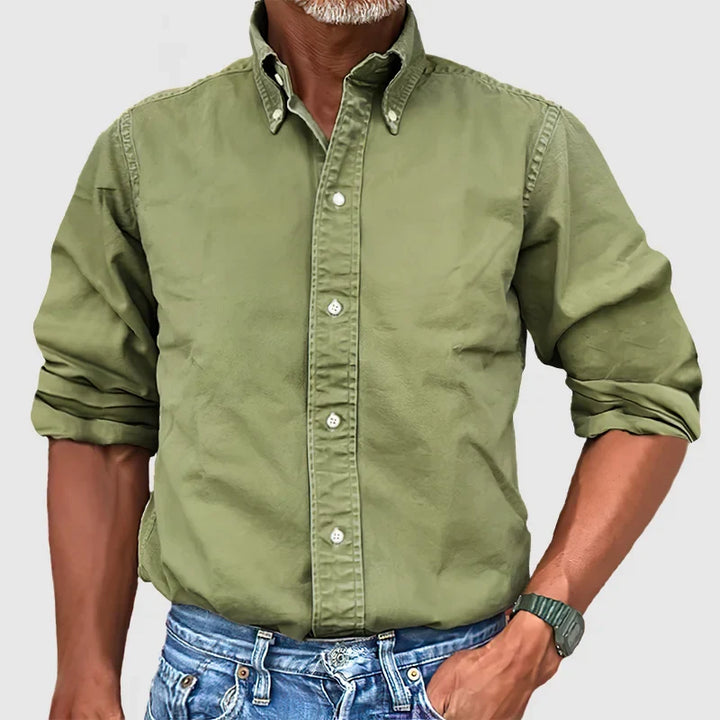 High-quality men's classic long-sleeve button-down. Essential fashion staple for adaptable wardrobe styling.