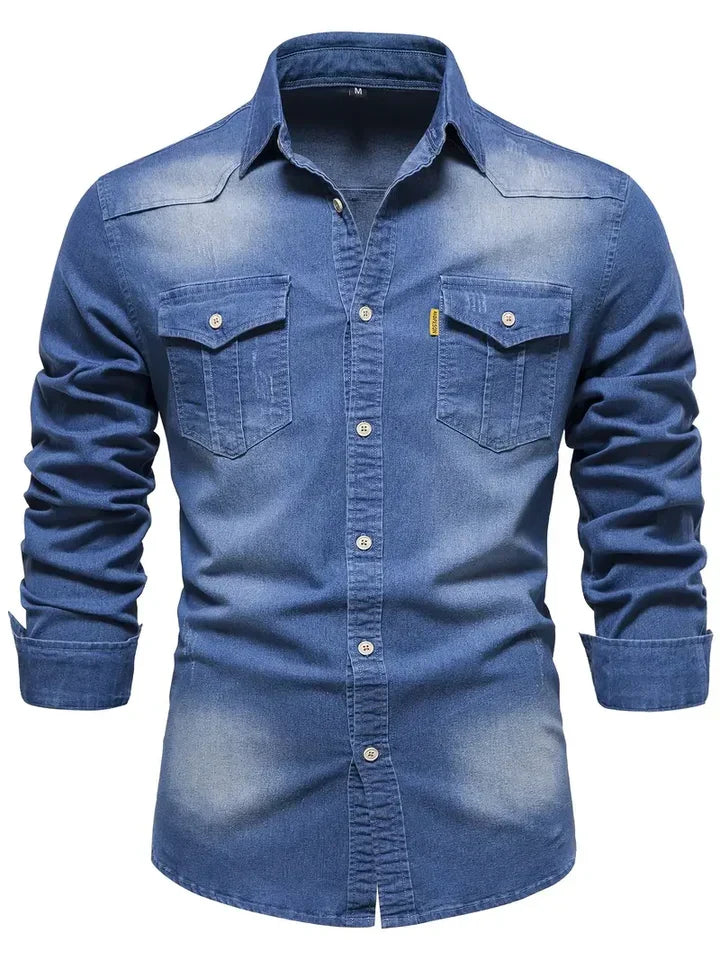 Close-up of a men's classic denim button-up shirt, showing the long sleeves and quality stitching.