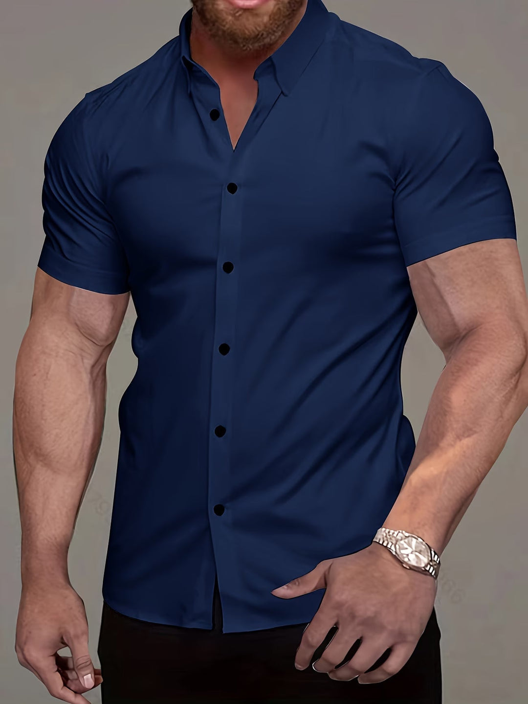 Smart casual men's short sleeve muscle fit button shirt, perfect for showcasing a confident, masculine physique.