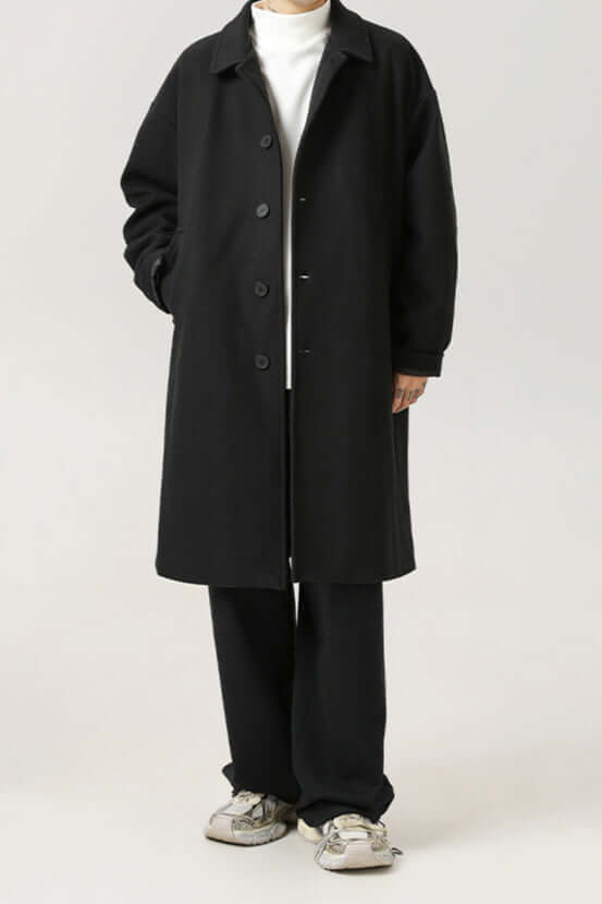 Stylish men's oversized winter coat with a classic design & button closure, versatile for layering and cool weather.