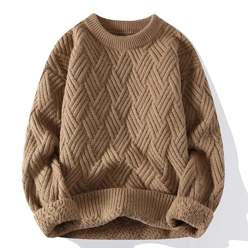 Close-up of a men's classic patterned crewneck sweater, highlighting the intricate textured knit detail.