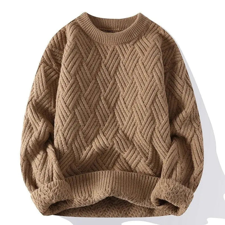 Close-up of a men's classic patterned crewneck sweater, highlighting the intricate textured knit detail.