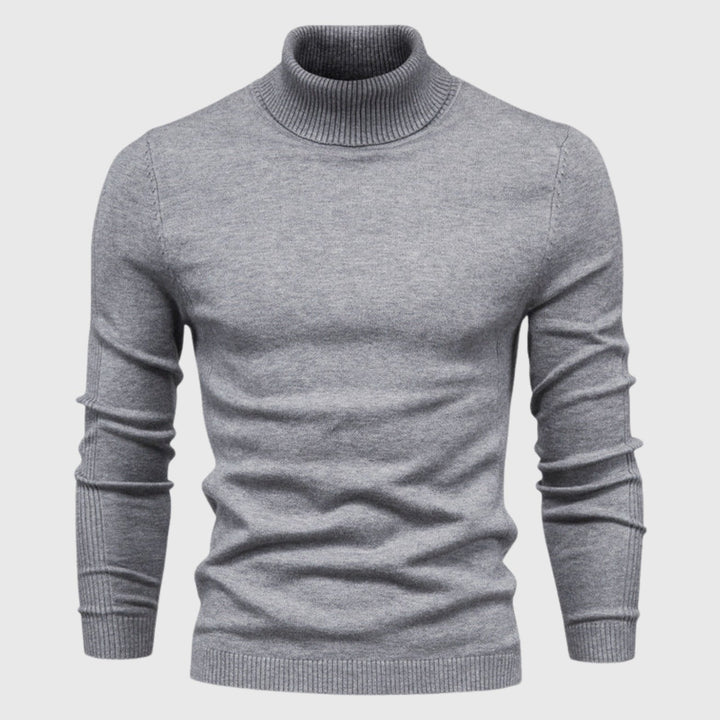 Comfortable long-sleeve men's roll neck jumper in soft grey, a versatile addition to any classic wardrobe.