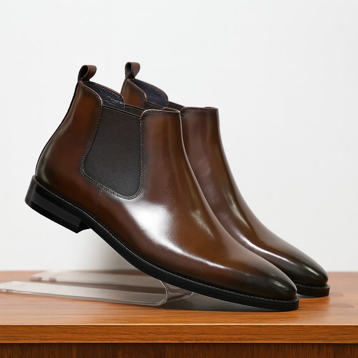 Men's classic slip-on Chelsea boots, elegant leather ankle footwear perfect for both dressy and casual outfits.