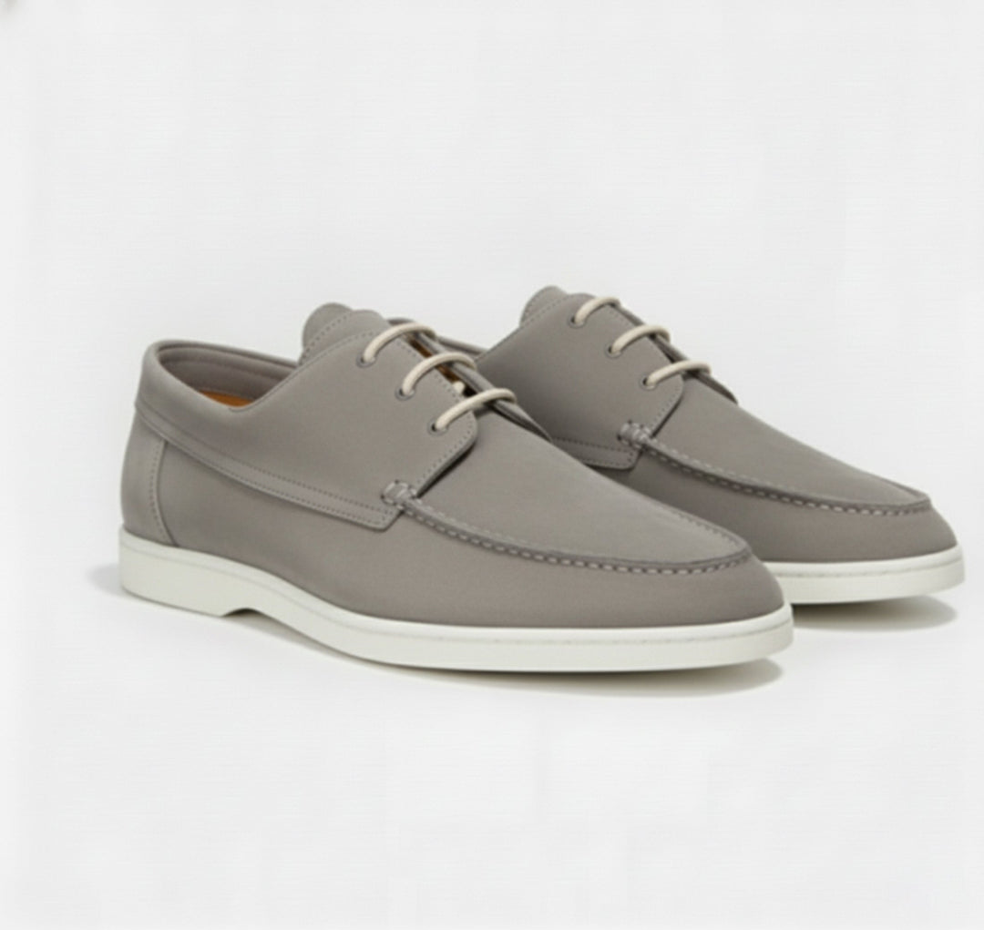 Elegant brown leather men's slip-on loafers, offering timeless style & exceptional comfort for smart casual outfits.