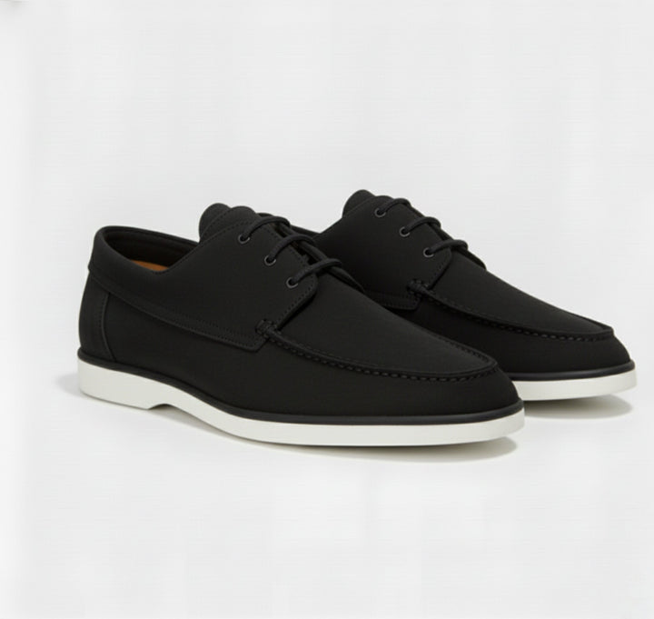 Detail shot of the refined top stitching on men's classic loafers, emphasizing quality & stylish men's footwear.