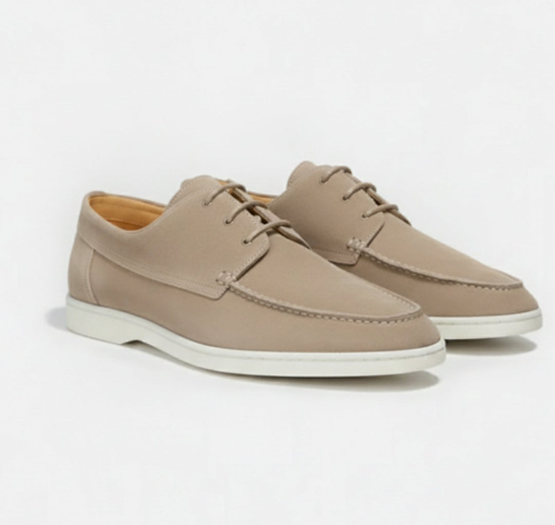 Men's classic slip-on loafers worn in a relaxed casual setting, showcasing comfort & timeless style for everyday.