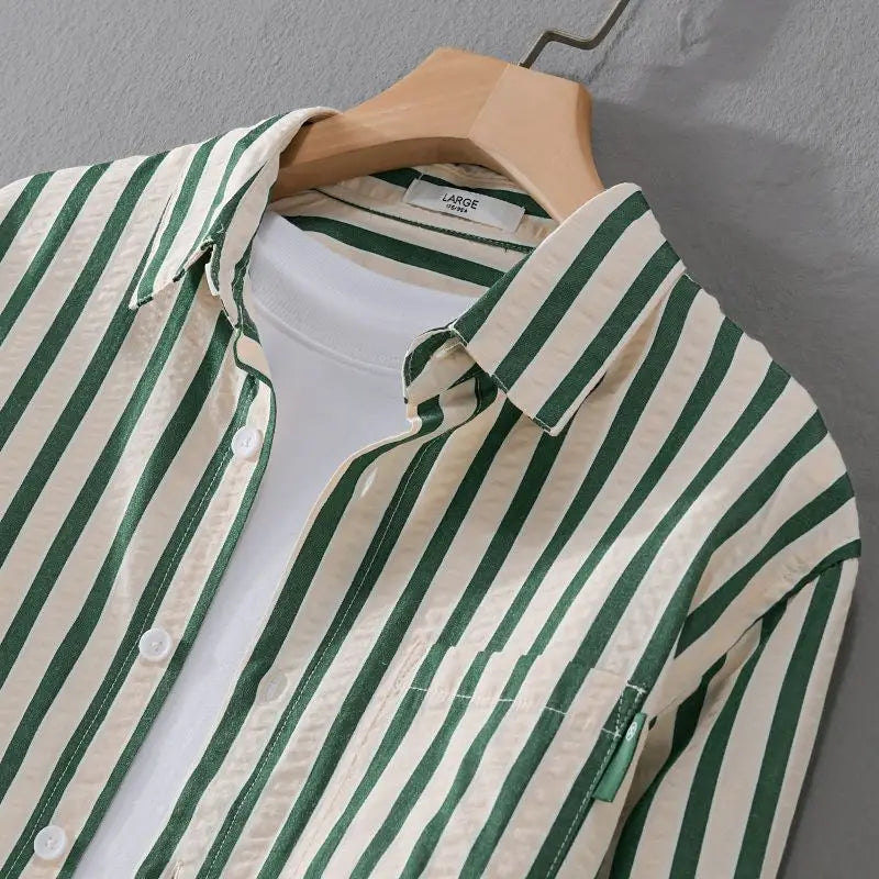 Relaxed fit men's long-sleeve striped button-down casual shirt, offering timeless classic style and comfort.