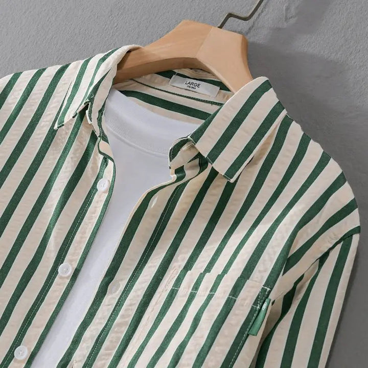 Relaxed fit men's long-sleeve striped button-down casual shirt, offering timeless classic style and comfort.