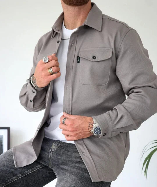 Men's casual long-sleeve shirt featuring practical chest pockets and a comfortable button-up design for daily utility.