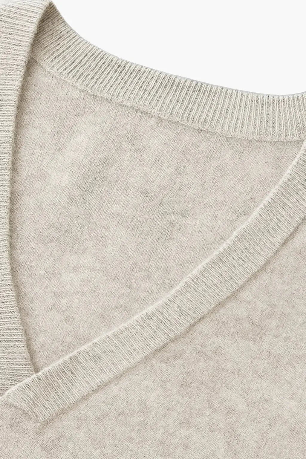 Comfortable men's V-neck cardigan sweater, a versatile wardrobe essential for autumn and winter layering.