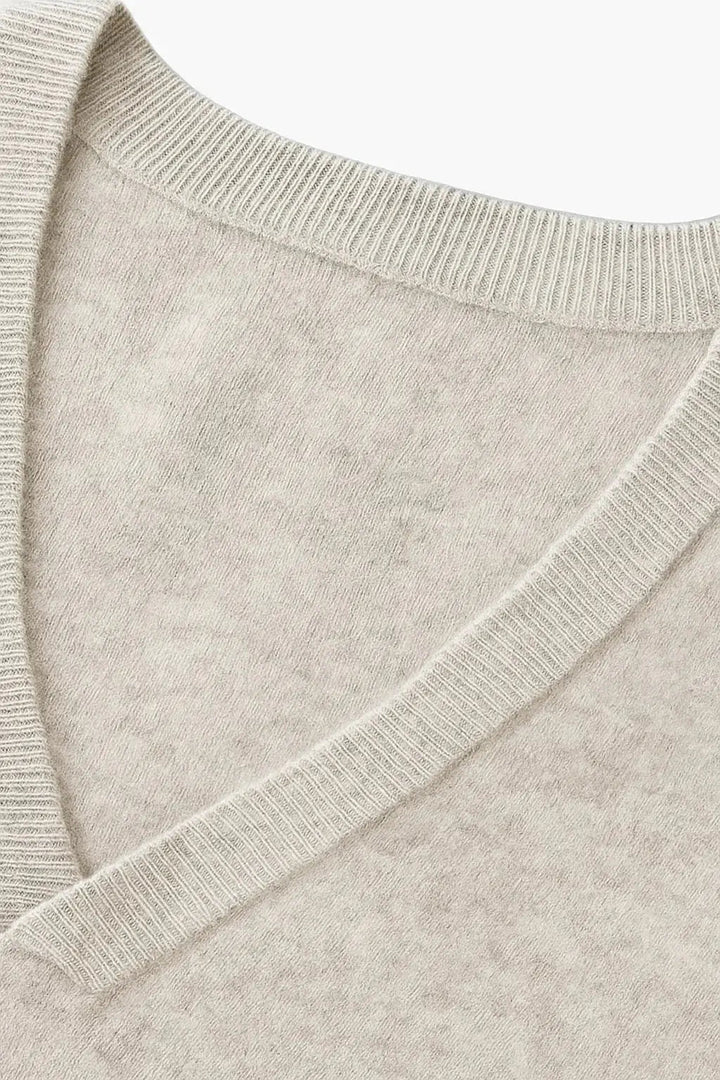 Comfortable men's V-neck cardigan sweater, a versatile wardrobe essential for autumn and winter layering.
