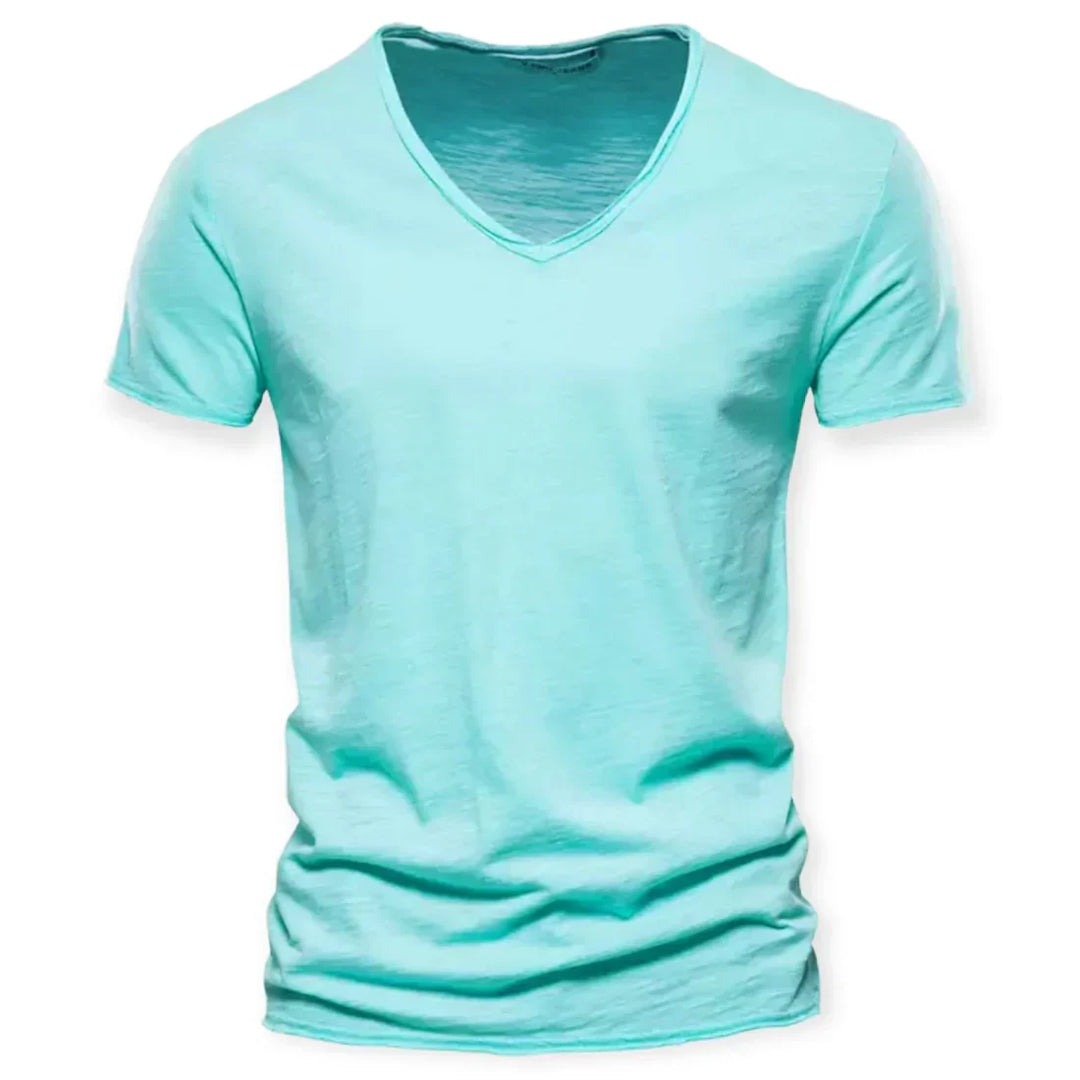 Model wearing a men's relaxed fit V-neck t-shirt, showcasing its casual appeal and effortless everyday style.