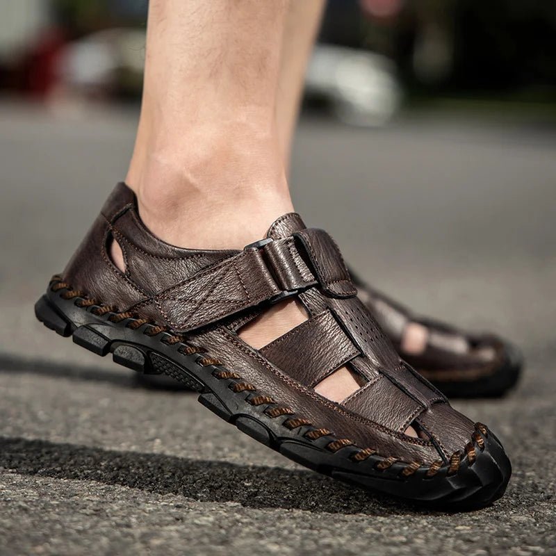 Two pairs of men's closed-toe leather fisherman sandals (brown & black) with hook-loop for summer comfort.