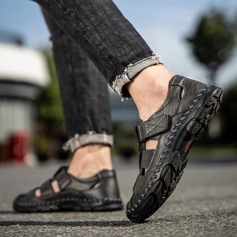 Close-up of hook-loop strap on men's closed-toe leather fisherman sandals for adjustable comfort & secure fit.