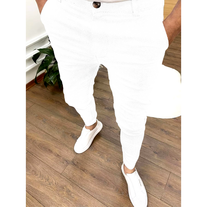 Modern men's grey chino trousers, a comfortable & versatile wardrobe essential for smart-casual styling.