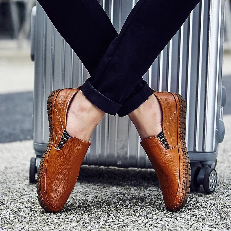 Side view of men's slip-on casual shoes, showcasing flexible sole and easy wear design for walking comfort.