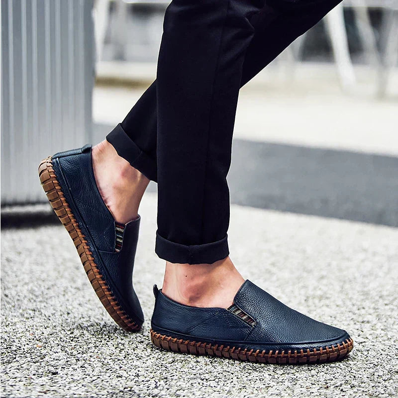 Top-down of men's loafer-style slip-on shoes, highlighting comfortable material & flexible sole for daily wear.