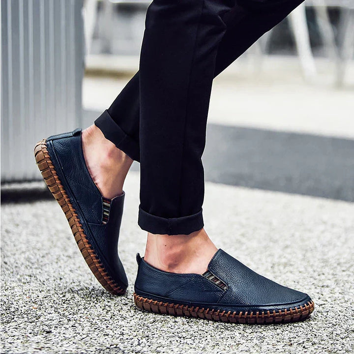 Top-down of men's loafer-style slip-on shoes, highlighting comfortable material & flexible sole for daily wear.