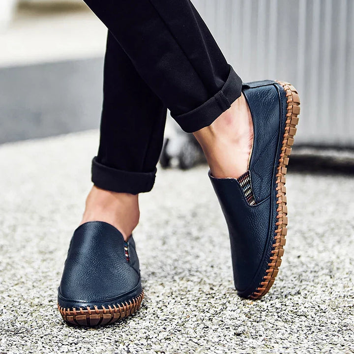 Man wearing comfortable men's slip-on walking shoes, perfect for daily casual fashion & effortless style.