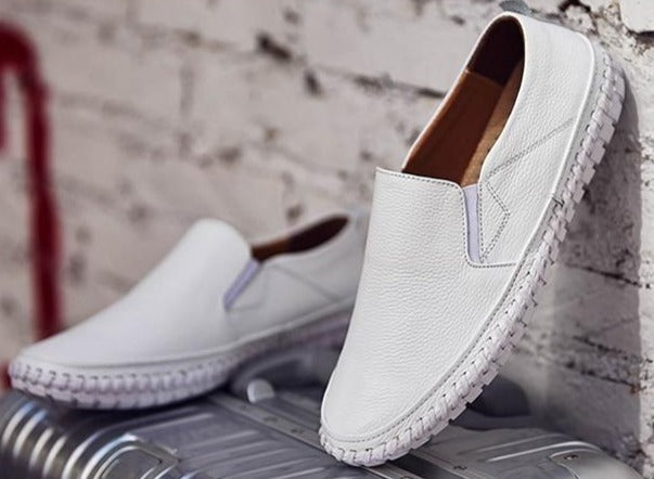 Pair of men's comfortable slip-on walking shoes, offering flexible sole & easy wear for everyday comfort.