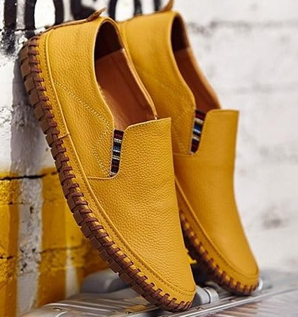 Experience daily comfort with these men's slip-on walking shoes, featuring a flexible sole & easy wear.