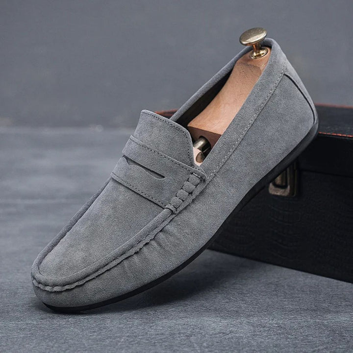 Grey men's comfort slip-on loafers, versatile for everyday style and driving.