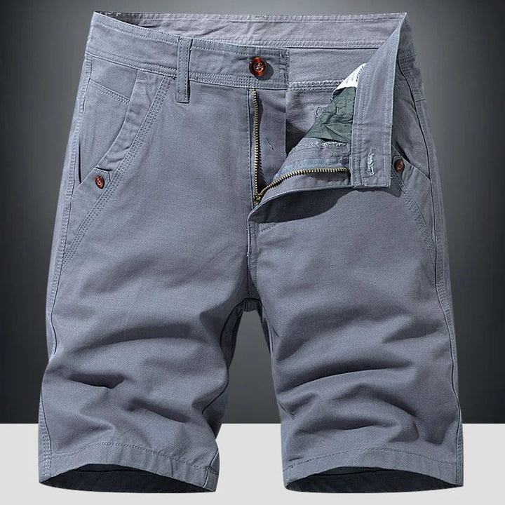 Men's comfortable relaxed fit chino shorts in a light color, perfect for warm weather and casual summer outfits.