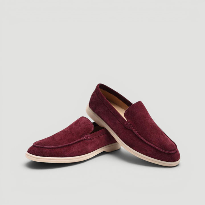 Classic black men's slip-on loafers, essential for elegant summer fashion.