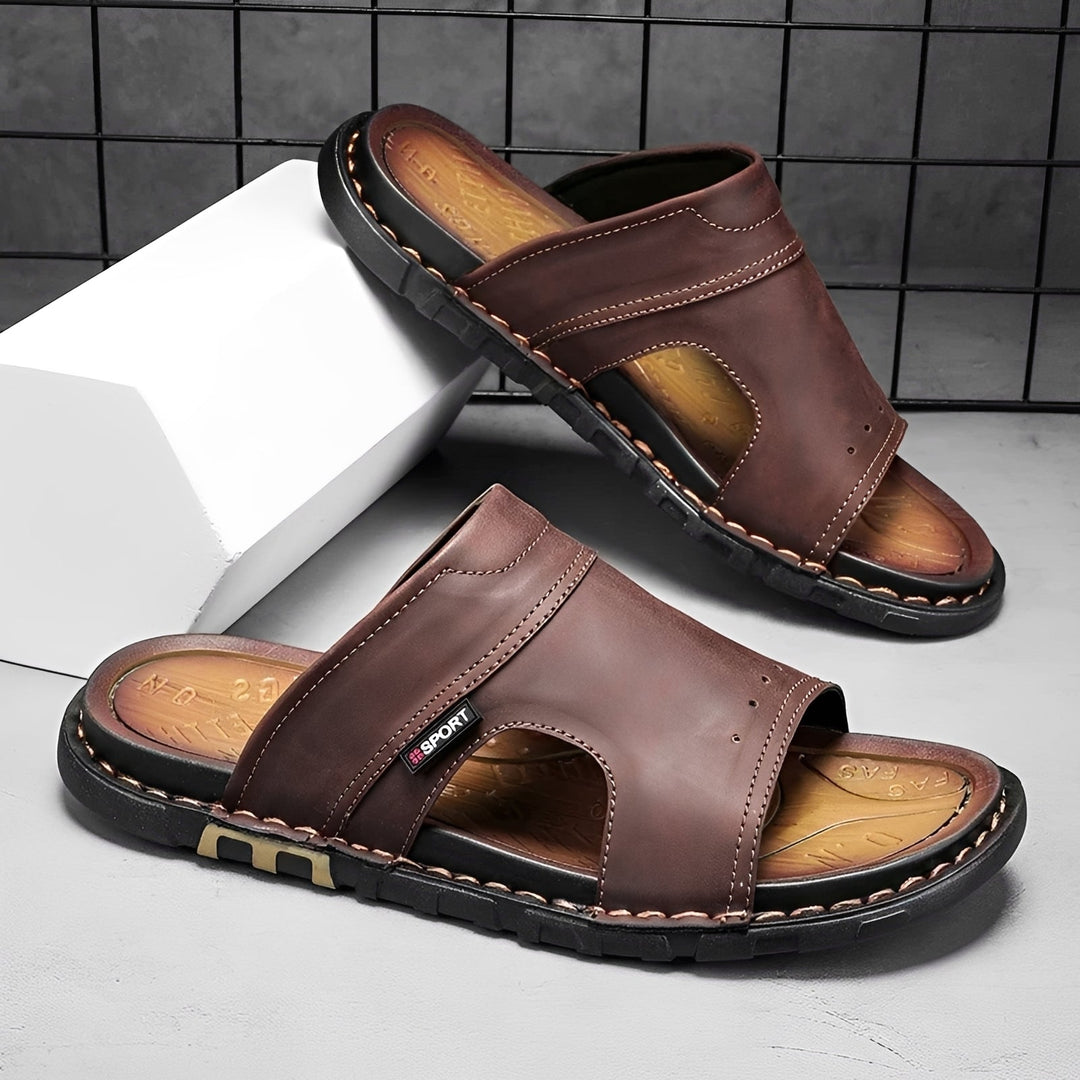 Men's comfortable wide fit slide sandals, perfect for summer beach days. Black slip-on casual footwear.