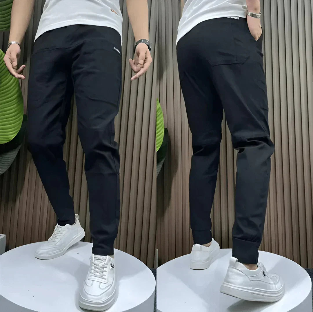 Versatile men's stretch cargo pants with multiple utility pockets & elastic waistband for comfort.