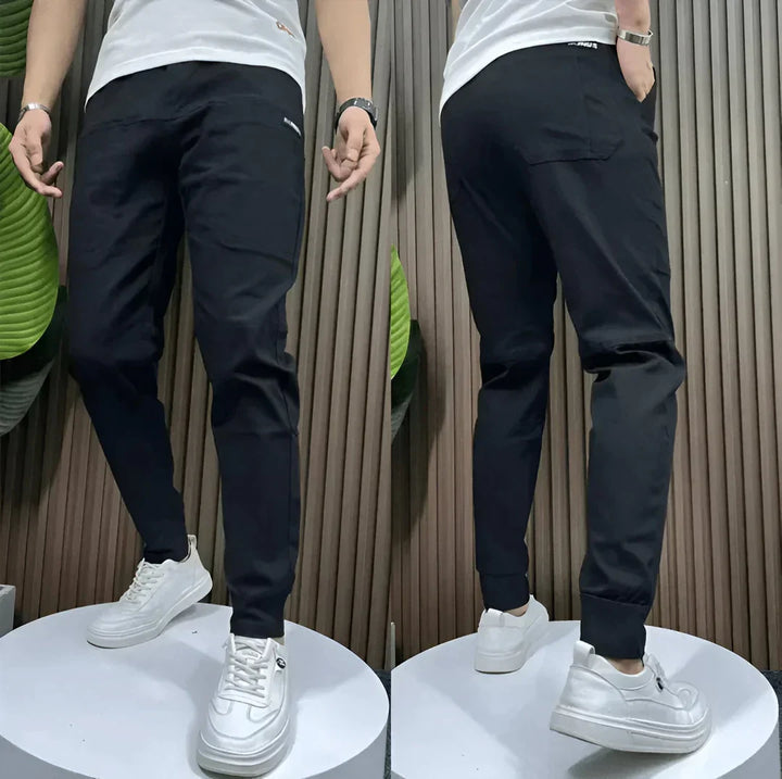 Versatile men's stretch cargo pants with multiple utility pockets & elastic waistband for comfort.